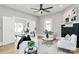 Bright living room with white sofa, hardwood floors, fireplace, and open floorplan at 908 W Airline Ave, Gastonia, NC 28052