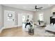 Bright living room with white sofa, hardwood floors, and access to office area at 908 W Airline Ave, Gastonia, NC 28052