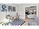 Bright office space with hardwood floors, modern artwork, and an open doorway at 908 W Airline Ave, Gastonia, NC 28052