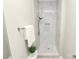 A stylish shower features marble-look tiling, sleek fixtures, and convenient in-wall niche at 908 W Airline Ave, Gastonia, NC 28052