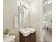 Clean and modern powder room with a vanity and decorative mirror at 9723 Mattforest Cir, Charlotte, NC 28277