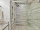 Contemporary bathroom featuring a glass shower with designer tile and a built-in shower seat at 9723 Mattforest Cir, Charlotte, NC 28277