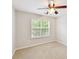 Bright bedroom with neutral walls, carpet, ceiling fan and a window offering natural light at 9723 Mattforest Cir, Charlotte, NC 28277