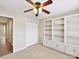 Comfortable bedroom showcasing a ceiling fan, closet, and built-in shelving units at 9723 Mattforest Cir, Charlotte, NC 28277