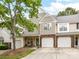 Charming townhome with a well-maintained lawn, attached garage and a welcoming front porch at 9723 Mattforest Cir, Charlotte, NC 28277