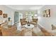Bright living room featuring modern decor, hardwood floors, and ample natural light at 9723 Mattforest Cir, Charlotte, NC 28277