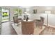 Bright living room featuring modern decor, hardwood floors, and ample natural light at 9723 Mattforest Cir, Charlotte, NC 28277