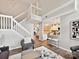 Open living room with staircase and view into kitchen at 9723 Mattforest Cir, Charlotte, NC 28277