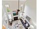 A high-angle view of the vaulted living room showing the fireplace and staircase at 9723 Mattforest Cir, Charlotte, NC 28277