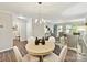 Spacious living area featuring an open floor plan, seamlessly connecting dining and seating areas at 9723 Mattforest Cir, Charlotte, NC 28277