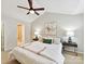 Large primary bedroom with a ceiling fan, side tables, and an ensuite bath at 9723 Mattforest Cir, Charlotte, NC 28277