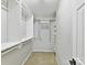 A well-organized walk-in closet with white shelving and ample storage space for clothing and accessories at 9723 Mattforest Cir, Charlotte, NC 28277
