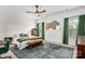 Serene bedroom with a ceiling fan, a cozy rug, natural light and green accents with a desk and green chair at 1024 Scotch Meadows Loop # 32, Monroe, NC 28110
