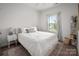 Bright bedroom with white walls, plush carpet, and a large window letting in natural light at 1024 Scotch Meadows Loop # 32, Monroe, NC 28110