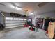Spacious garage featuring ample storage, shelving, and a functional door at 1024 Scotch Meadows Loop # 32, Monroe, NC 28110