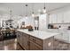 Modern open kitchen with a large island, white countertops, stainless steel appliances, and dark wood floors at 1024 Scotch Meadows Loop # 32, Monroe, NC 28110