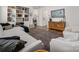 Inviting living room with wood floors, a plush gray sofa, and a beautiful area rug, featuring built-in shelving at 1024 Scotch Meadows Loop # 32, Monroe, NC 28110
