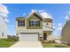 Charming two-story home featuring a two-car garage and well-manicured lawn at 121 Dorian Pl, Troutman, NC 28166