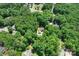 An aerial view of a house surrounded by a canopy of trees, creating a serene setting at 122 Roxboro Ct # 286, Mount Gilead, NC 27306
