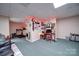 Basement area featuring carpeting, decorations, and a treadmill at 122 Roxboro Ct # 286, Mount Gilead, NC 27306