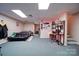 Spacious basement area with carpeting, LED lighting, and a black futon at 122 Roxboro Ct # 286, Mount Gilead, NC 27306