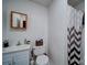 Cozy bathroom with a white sink, toilet, and shower with patterned curtain at 122 Roxboro Ct # 286, Mount Gilead, NC 27306