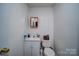 Small bathroom features a white sink, toilet, and mirror at 122 Roxboro Ct # 286, Mount Gilead, NC 27306