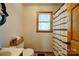 Bathroom features a toilet, patterned shower curtain, and natural light from the window at 122 Roxboro Ct # 286, Mount Gilead, NC 27306