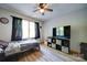 Comfortable bedroom with wood-look flooring, natural light, and a ceiling fan for added comfort at 122 Roxboro Ct # 286, Mount Gilead, NC 27306