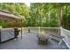 Outdoor deck featuring a barbecue grill, a fire pit, and plenty of space for relaxing at 122 Roxboro Ct # 286, Mount Gilead, NC 27306