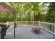 Outdoor deck featuring a barbecue grill, a fire pit, and plenty of space for relaxing at 122 Roxboro Ct # 286, Mount Gilead, NC 27306