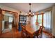 Traditional dining room with wooden table, chairs, and a large window overlooking the yard at 122 Roxboro Ct # 286, Mount Gilead, NC 27306