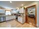 Bright kitchen featuring white cabinets, stainless steel appliances, and hardwood floors at 122 Roxboro Ct # 286, Mount Gilead, NC 27306