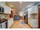 Spacious kitchen features stainless steel appliances, white cabinetry, and wood flooring at 122 Roxboro Ct # 286, Mount Gilead, NC 27306