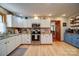 Bright kitchen features white cabinetry, stainless steel appliances, and a granite countertop at 122 Roxboro Ct # 286, Mount Gilead, NC 27306