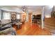 Bright living room with hardwood floors, fireplace and exterior views at 122 Roxboro Ct # 286, Mount Gilead, NC 27306