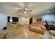Spacious living room with wood-look floors, and natural light, creating a bright and inviting atmosphere at 122 Roxboro Ct # 286, Mount Gilead, NC 27306