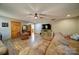 Inviting living room with wood-look floors, ceiling fan, and ample space for entertaining at 122 Roxboro Ct # 286, Mount Gilead, NC 27306