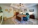 Main bedroom with tray ceiling, rustic decor, and wood-look floors at 122 Roxboro Ct # 286, Mount Gilead, NC 27306