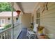 Cozy front porch featuring a rocking chair, hanging plants, and decorative accents at 122 Roxboro Ct # 286, Mount Gilead, NC 27306