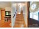 Stairway leading to the upper level near the front door and living room area at 122 Roxboro Ct # 286, Mount Gilead, NC 27306