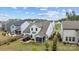 Aerial view of a home showcasing the fenced backyard, patio with a hot tub, and screened-in porch at 1548 Striped Bass Ln, Clover, SC 29710