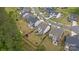 Aerial view of a neighborhood showcasing a home with a fenced backyard, patio, and screened-in porch at 1548 Striped Bass Ln, Clover, SC 29710