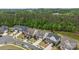 Beautiful aerial view of neighborhood featuring well-maintained homes and landscaping adjacent to wooded area at 1548 Striped Bass Ln, Clover, SC 29710