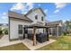 Backyard showcasing a patio with a hot tub under a gazebo, grill, screened-in porch, and lawn at 1548 Striped Bass Ln, Clover, SC 29710