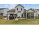 Backyard showcasing a patio with a hot tub under a gazebo, grill, screened-in porch, and lawn at 1548 Striped Bass Ln, Clover, SC 29710