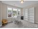 Bedroom showcasing a dedicated workspace with desk, chair and shelving and large window at 1548 Striped Bass Ln, Clover, SC 29710