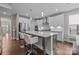 Beautiful kitchen with stainless steel appliances and a center island with modern pendant lighting at 1548 Striped Bass Ln, Clover, SC 29710