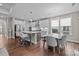 Open kitchen with stainless steel appliances, island with seating, and adjacent dining area at 1548 Striped Bass Ln, Clover, SC 29710