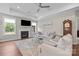 Living area showcasing a fireplace, large windows, and classic decor at 1548 Striped Bass Ln, Clover, SC 29710